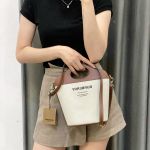 Túi Đeo Chéo Nữ Burberry Pocket Two-tone Canvas and Leather Bucket Bag Màu Nâu Kem